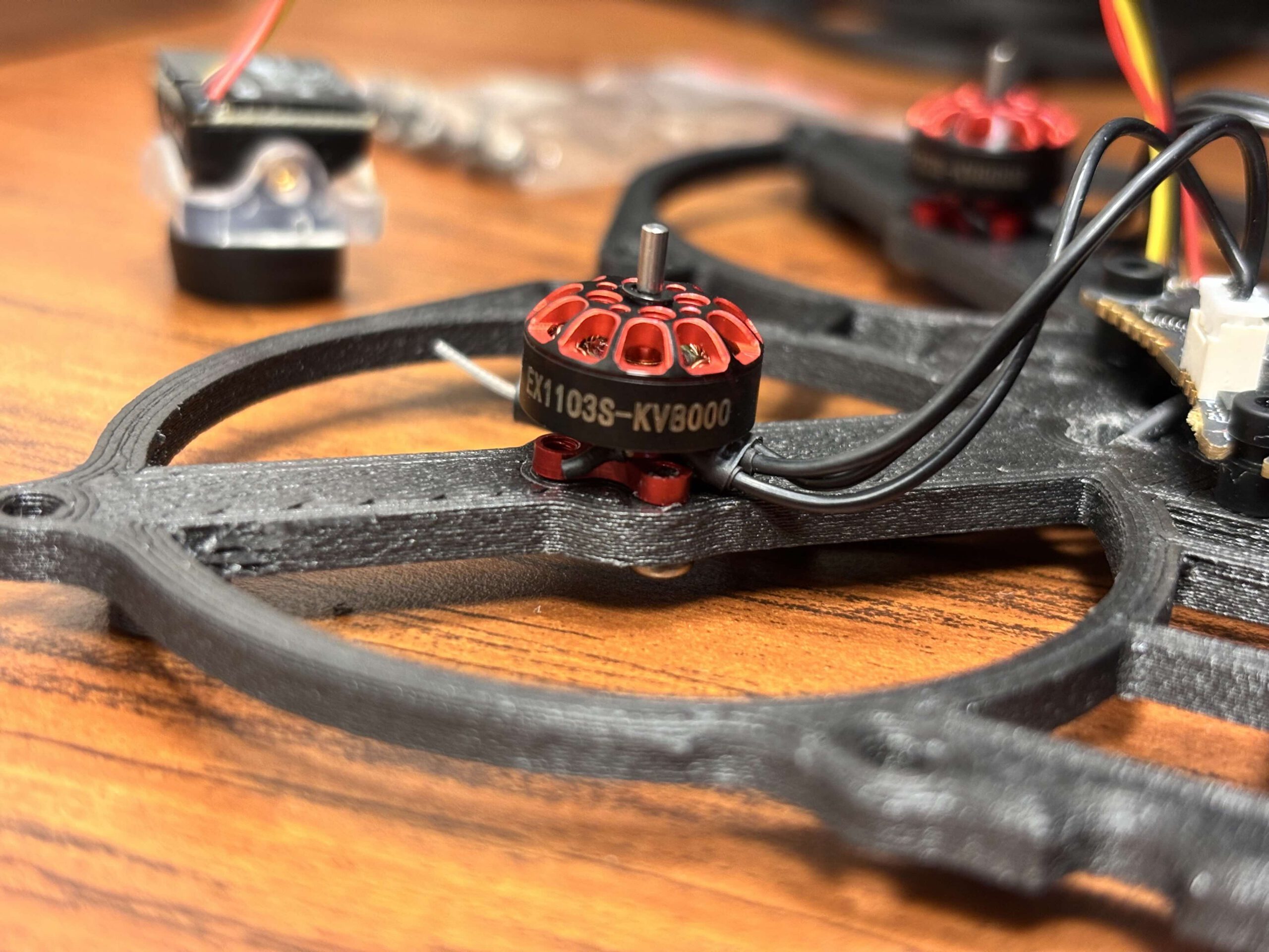 Small drone components; installing motors, flying controller board, camera, etc into 3d printed canopy.